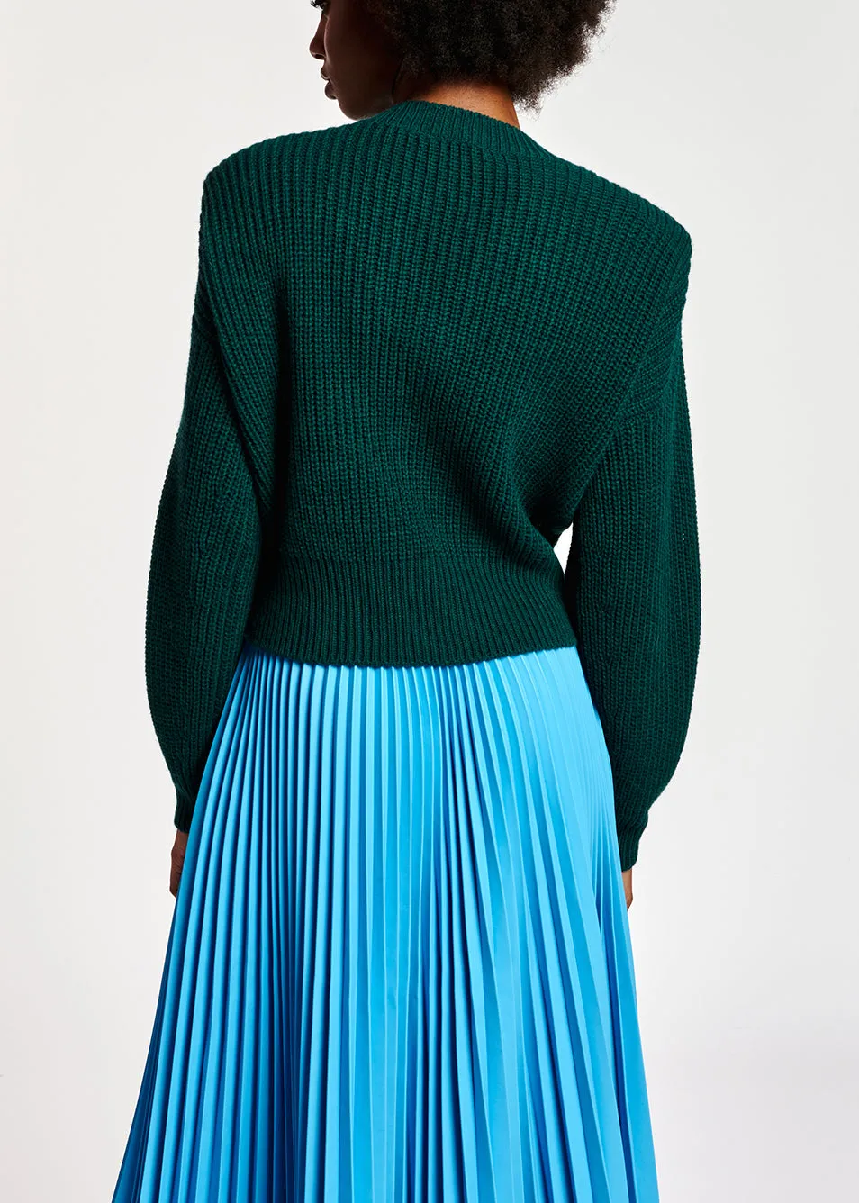 Dark green sweater with padded shoulders