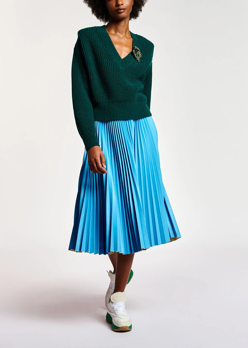 Dark green sweater with padded shoulders