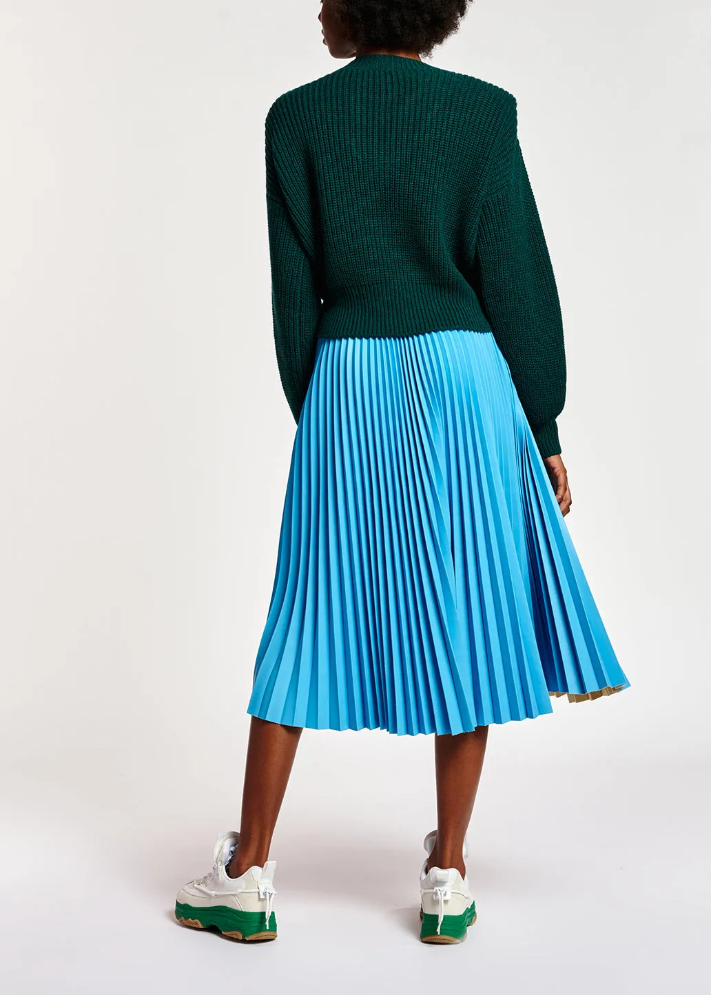 Dark green sweater with padded shoulders